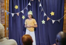 Photo of middle school student acting in play